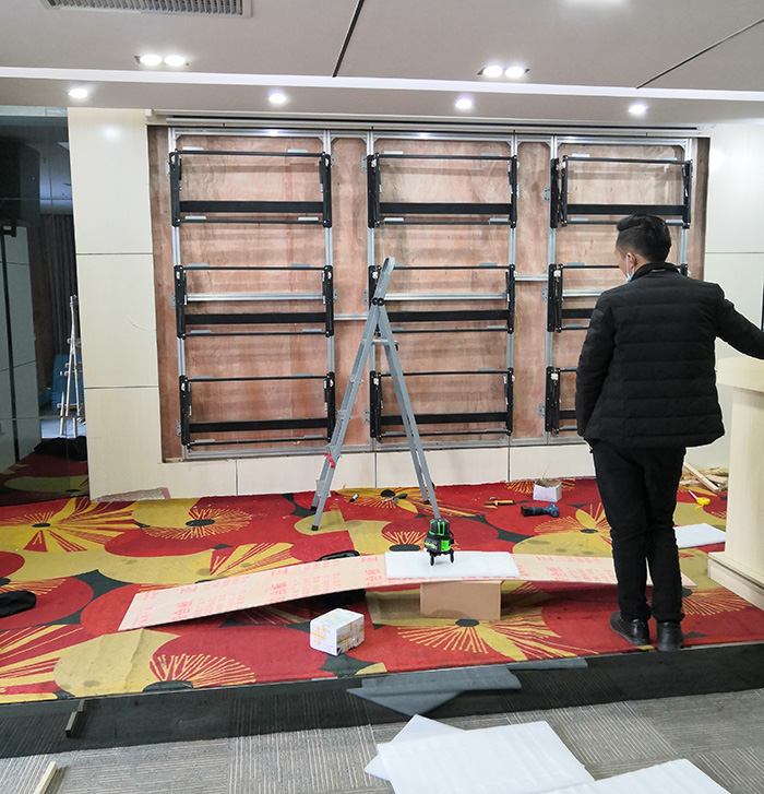 液晶拼接屏液压前维护支架的工作原理